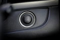 Close up engine car start button. Start stop engine modern new car button,Makes it easy to turn auto mobile on and off. a key fob Royalty Free Stock Photo