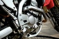 Close-up of the engine of a modern motocross motorcycle on the street Royalty Free Stock Photo