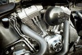 Close-up engine a motorcycle with a chrome frame and an exhaust system Royalty Free Stock Photo