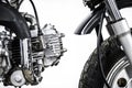 Close up of engine on vintage motorcycle. Custom scrambler motocross. Retro motorbike on white background. Royalty Free Stock Photo