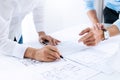 Close up of engineer hands discussing a building construction project at workplace Royalty Free Stock Photo