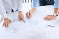 Close up of engineer hands discussing a building construction project at workplace Royalty Free Stock Photo