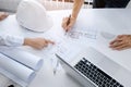 Close up of engineer hands discussing a building construction project at workplace Royalty Free Stock Photo