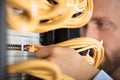 Engineer Plugging Cables Into Server