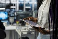 Close up of engineer in server room using tablet to review diagnostics Royalty Free Stock Photo