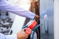 Close-up engineer using measuring manifold gauge for filling industrial air conditioner after cleaner and checking for maintenance Royalty Free Stock Photo