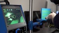 Close up of an engineer using modern welding equipment and a computer for welding process at the factory. Scene. Modern