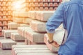 Close up of engineering man in blue jean with white helmet in hand at construction site Royalty Free Stock Photo