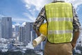 Close up engineers working on a building site holding a blueprints, Engineering and architecture concept Royalty Free Stock Photo