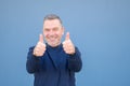 Close up of a man giving a double thumbs up gesture with a beaming smile Royalty Free Stock Photo