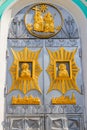 Close-up of entrance door decorated with gilded icons in Trinity cathedral of Holy Trinity-Saint Seraphim-Diveyevo Monastery