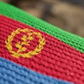 Close-up of the Eritrean flag, displaying its texture. The flag features horizontal stripes Royalty Free Stock Photo