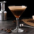 Close up of an Espresso Martini Cocktail based on coffee, liqueur and vodka isolated on a dark grey background. Served in an Royalty Free Stock Photo