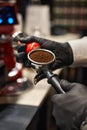 Close-up of espresso pouring from coffee machine. Professional coffee brewing. Focus selection point Royalty Free Stock Photo