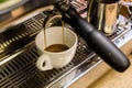 Close-up of espresso pouring from coffee machine Royalty Free Stock Photo