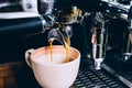 Close-up, Espresso pouring from making fresh coffee machine. Professional coffee shop. Vintage color tone Royalty Free Stock Photo