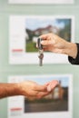 Close Up Of Estate Handing Over Keys Of New Home Royalty Free Stock Photo