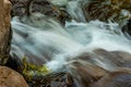 the water of the estuary like silk flows between the rocks in the mountain