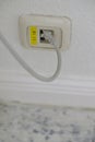 Close-up of Ethernet Wall Socket with Cable Royalty Free Stock Photo