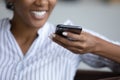 Close up of ethnic woman record voice message on cell Royalty Free Stock Photo