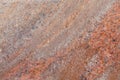 Close-up of even red granite surface with blotchiness