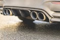 close up exaust pipe of a car releasing gas b Royalty Free Stock Photo