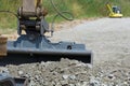 Excavator produces crushed stone planum