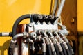 Close up of excavator hydraulic pipes