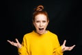 Close-up of excited angry young woman screaming with closed eyes on isolated black background. Royalty Free Stock Photo