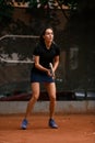 close-up of excited athletic woman tennis player with racket in her hands on tennis court Royalty Free Stock Photo