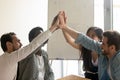 Excited multiethnic colleagues give high five celebrating success Royalty Free Stock Photo