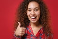 Close up of excited young african american girl in pajamas homewear posing while resting at home isolated on red Royalty Free Stock Photo