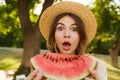 Close up of excited young girl in summer hat spending time at the park, Royalty Free Stock Photo