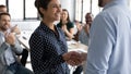 Close up executive shaking smiling Indian businesswoman hand at meeting Royalty Free Stock Photo