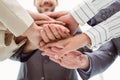 Close up of executives holding hands together Royalty Free Stock Photo