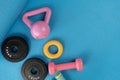 exercising sport equipment on the blue yoga mat background, healthy and workout concept Royalty Free Stock Photo