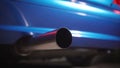 Close-up of the exhaust pipe of a tuned sports car. Part symbol and conceptual tuning, motorsport, workshops, background Royalty Free Stock Photo