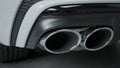 Close-up of exhaust pipes of new car. Action. Double exhaust pipe on new car model with luxury design. New Car parts Royalty Free Stock Photo