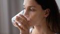 Close up exhausted thirsty woman drinking pure mineral water Royalty Free Stock Photo