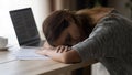 Close up exhausted unmotivated young woman sleeping at workplace Royalty Free Stock Photo