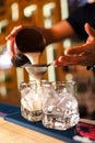 Close-up of expert bartender making cocktail in bar Royalty Free Stock Photo