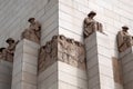 Close up of the exterior of ANZAC Memorial adorned with granite reliefs and sculptures of service personnel