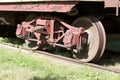 Close up exterior view of the wheels under an old 19th Century railroad train boxcar Royalty Free Stock Photo