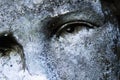 Close up eye view of Virgin Mary. Vintage statue of sad woman in grief Religion, faith, suffering, love concept Royalty Free Stock Photo