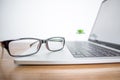 Close up. Eyeglasses of a businessman on a computer in the office