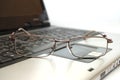 Close up Eyeglasses on laptop