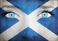 Close up of eyes. Painted face with flag of Scotland