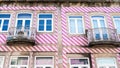 Facade of colorful pink striped house in Braga, Portugal.