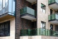 Close-up of the facade of a modern residential building with glass balconies Royalty Free Stock Photo