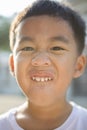 Close up face of asian children showing milk tooth